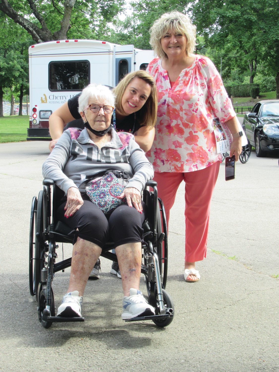 HELPING HANDS: Cherry Hill Manor resident Anna Amalfitano gets help from super staffers Christine Garafalo and Lorraine DiLorenzo during last week's season opening of Walk with Cops.